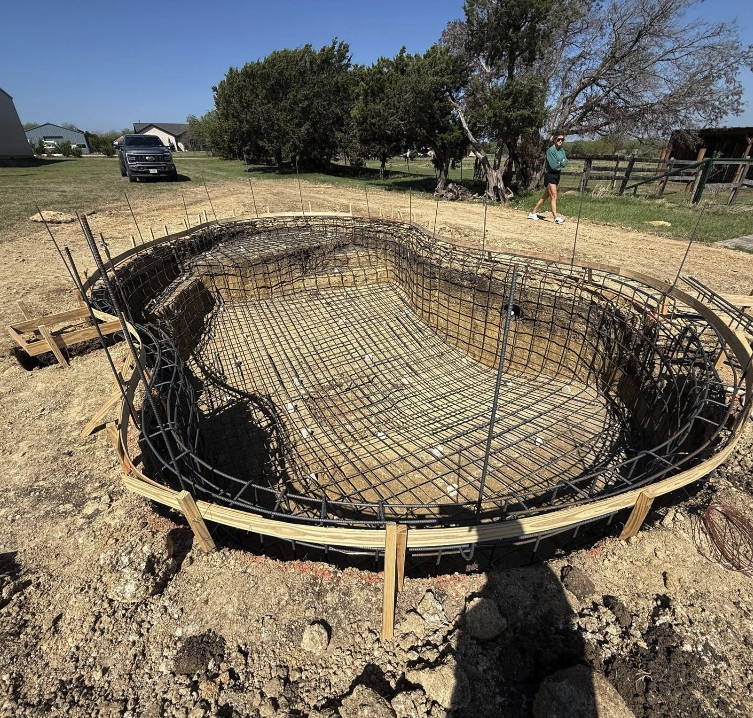 Pool excavation with steel rebar cage tied and formed
