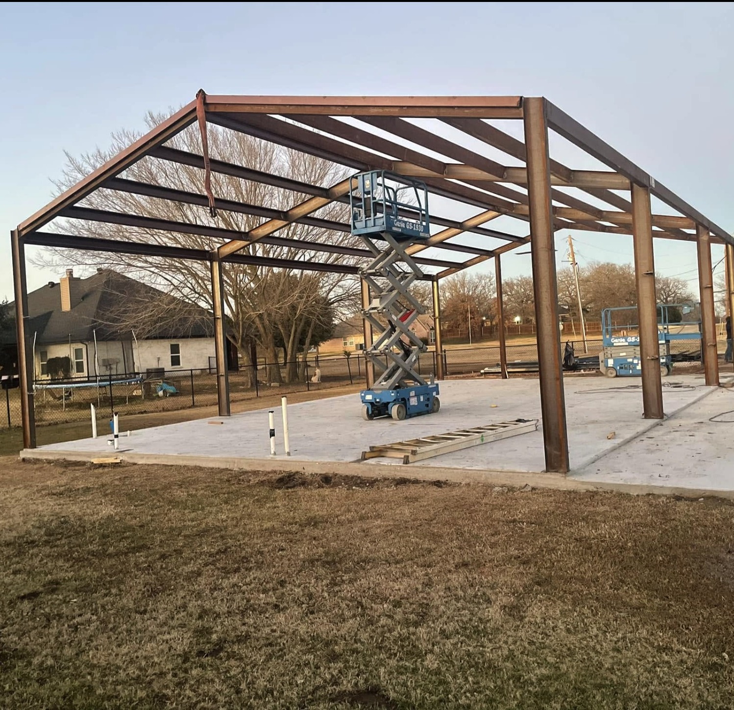 Steel pavilion frame going up from a scissor lift